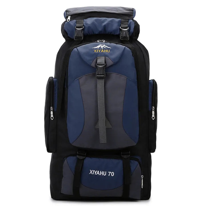 Sac à dos de randonnée Xiyahu bleu marine présenté de trois quarts, avec système de portage renforcé et poches multiples.