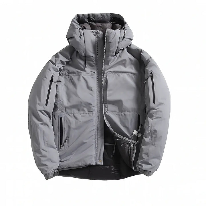 Veste grise softshell pour homme, conçue pour la randonnée et les activités extérieures, avec fermeture zippée et design fonctionnel.