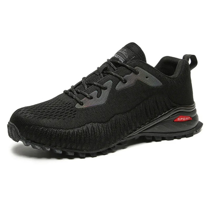  Chaussure de randonnée basse noire en tissu respirant avec semelle crantée.
