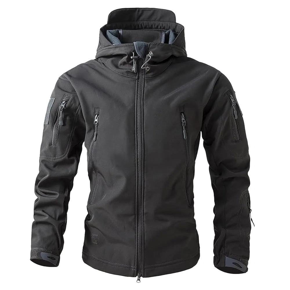 Veste softshell grise coupe-vent adaptée à la randonnée et au bivouac.